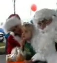 Tyler Mathewson, 2, of Daytona, meets Santa in NSB.